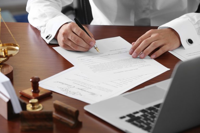 Estate lawyer reviewing documents for probate and letters of administration