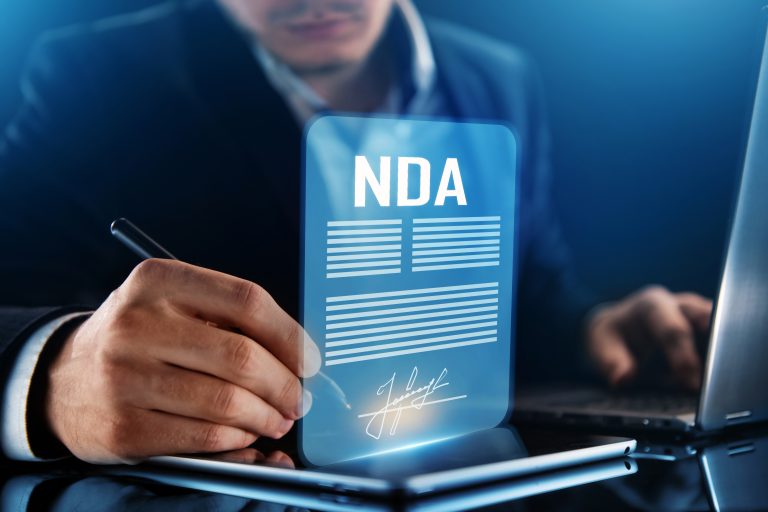 Person consulting an Australian lawyer about drafting an NDA or confidentiality agreement.