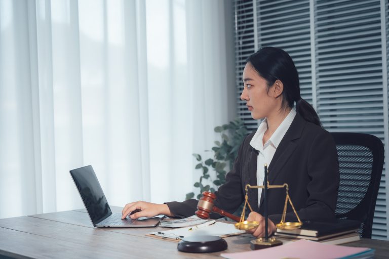 Person reviewing a contract disagreement with a legal adviser in Australia.