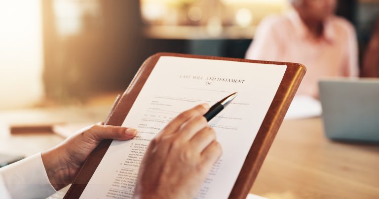 Person reviewing documents to prevent future inheritance conflicts