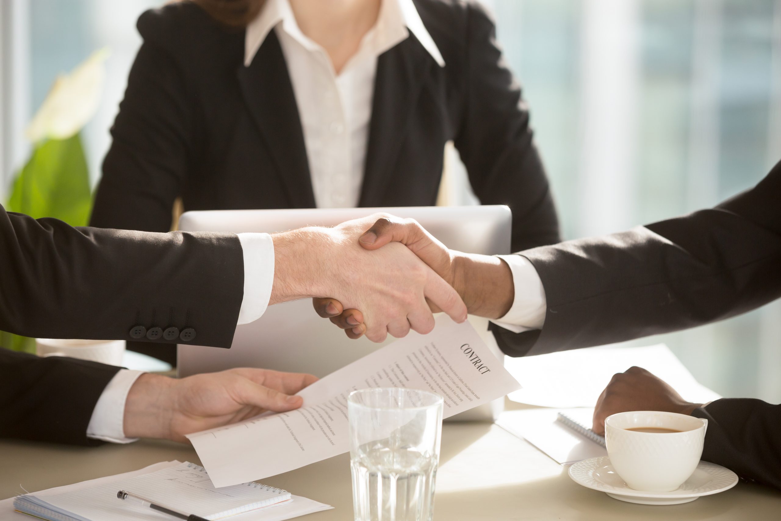 Australian franchise lawyers shaking hands.