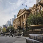 Featured image for When Can Demerit Points Lead to Licence Suspension in VIC? - A bustling Melbourne street scene during the