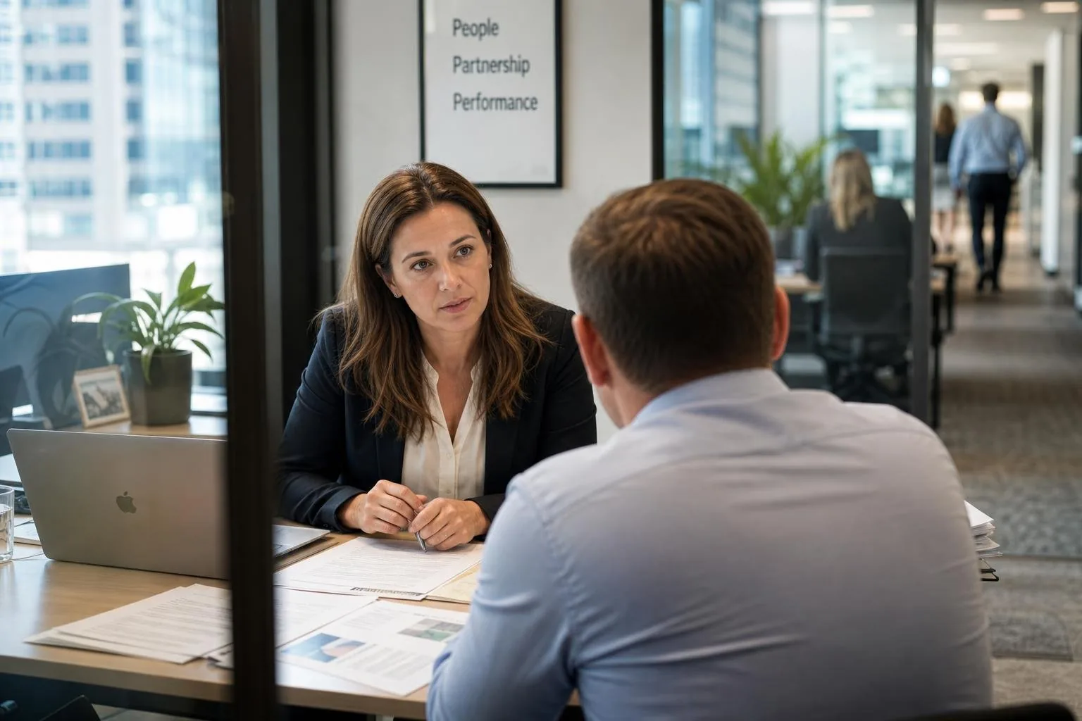 Featured image for How Do Redundancy Laws Affect Employers in Australia? - Capture a modern Australian CBD office setting foc