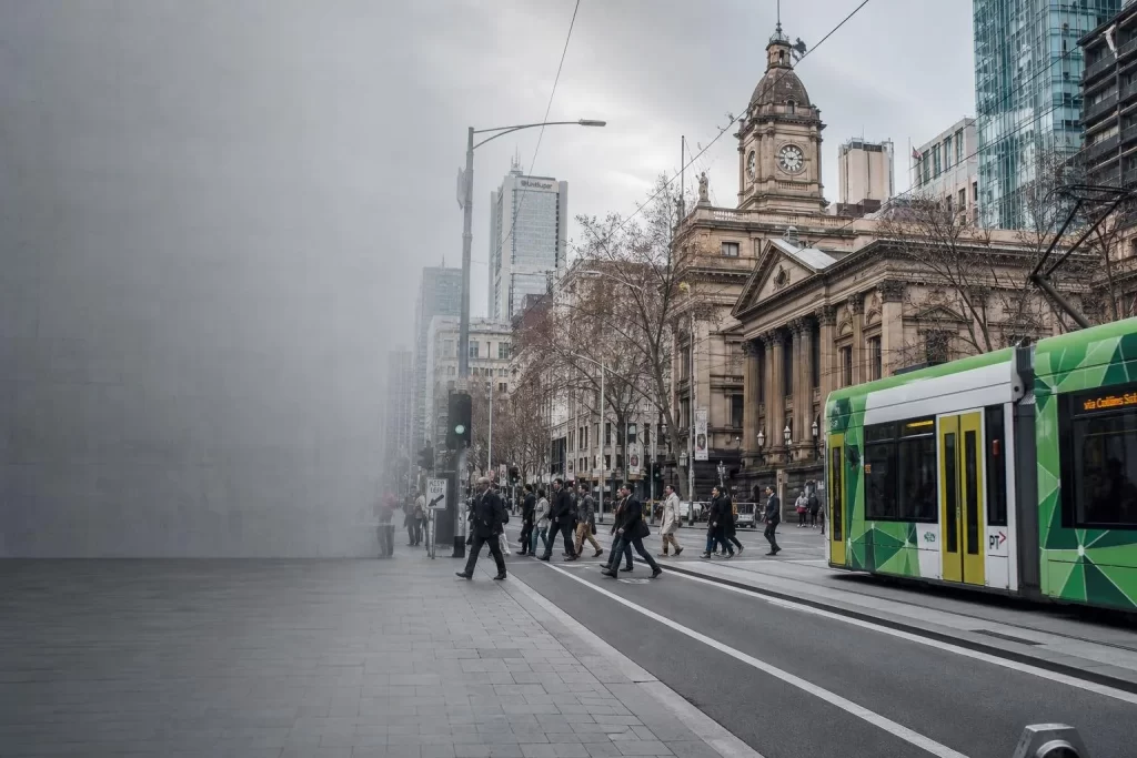 Featured image for What Are the Penalties for Speeding in Victoria? - A bustling street scene in Melbourne during daylight ca