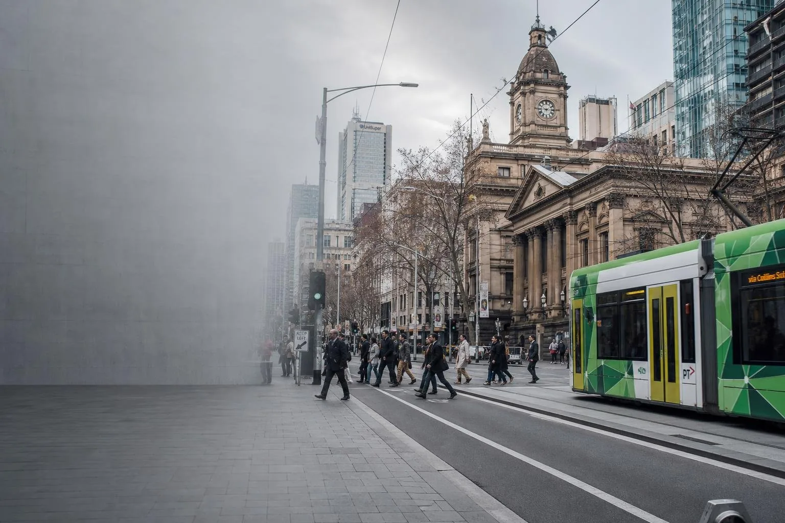 Featured image for What Are the Penalties for Speeding in Victoria? - A bustling street scene in Melbourne during daylight ca
